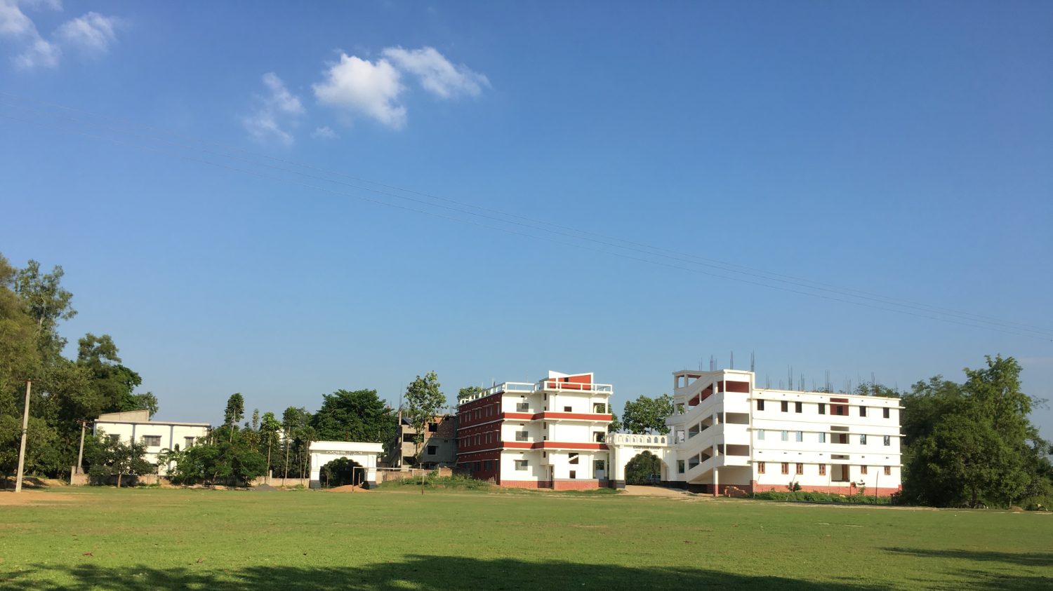 Front view of the campus across the field
