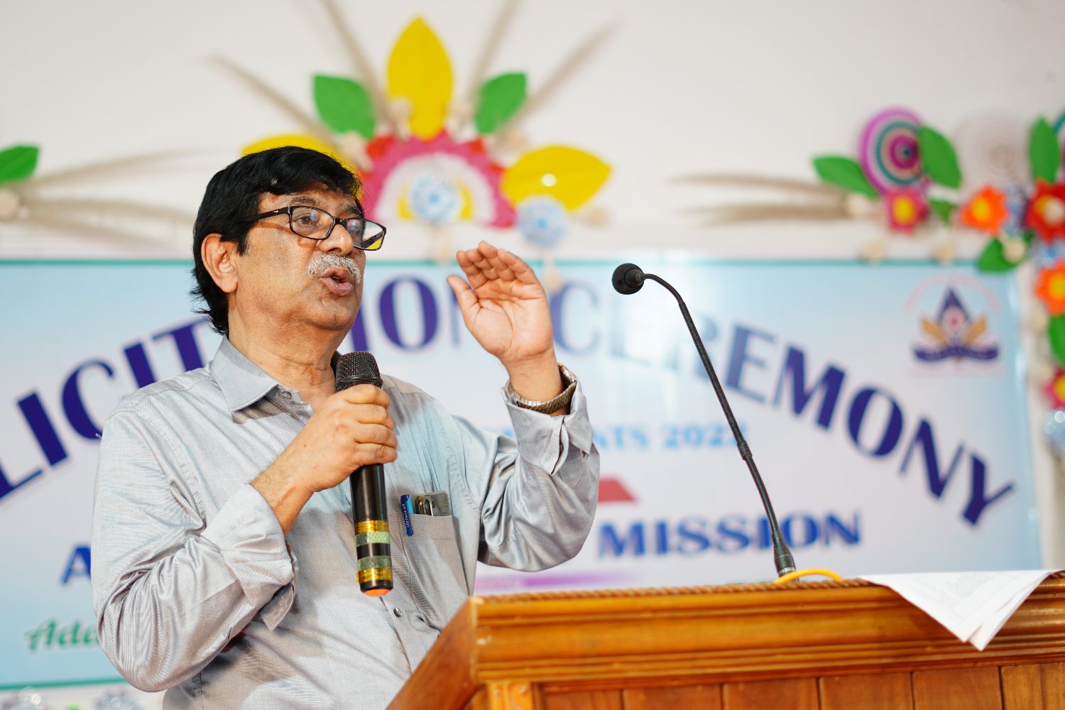 The Secretary of Adarshabani Academy addressing a ceremony